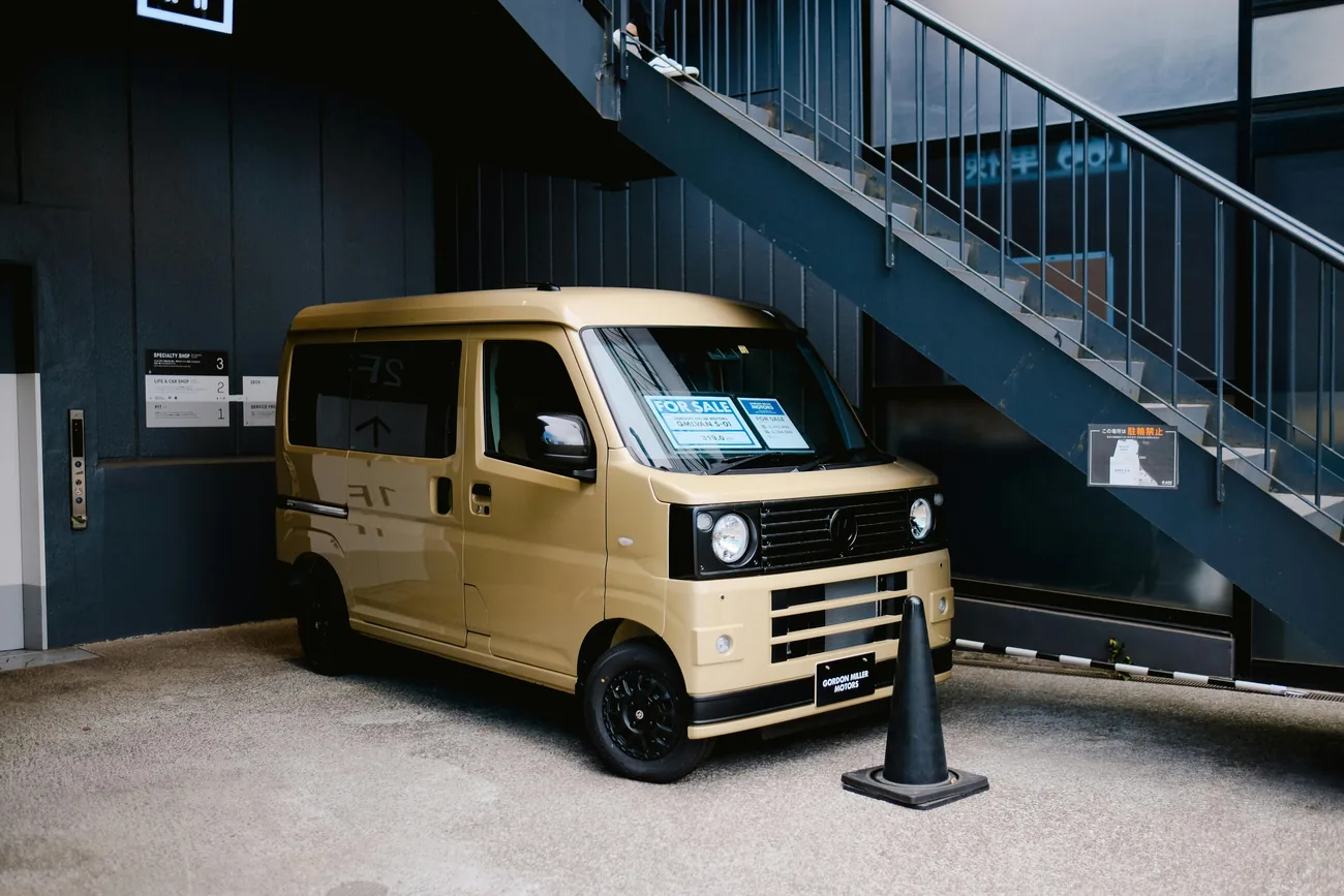 A compact yellow van available for sale